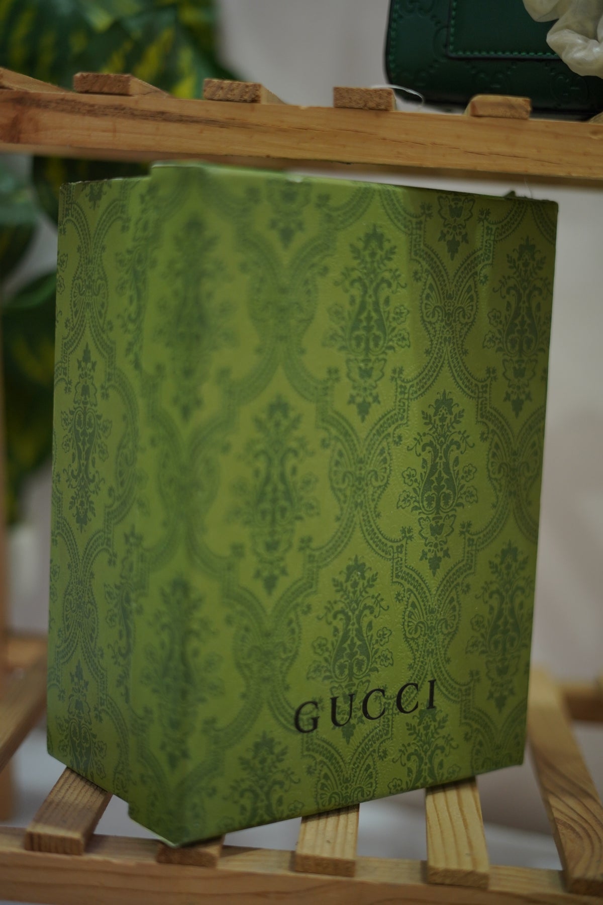 A4. Emerald Signature Lock Crossbody Bag