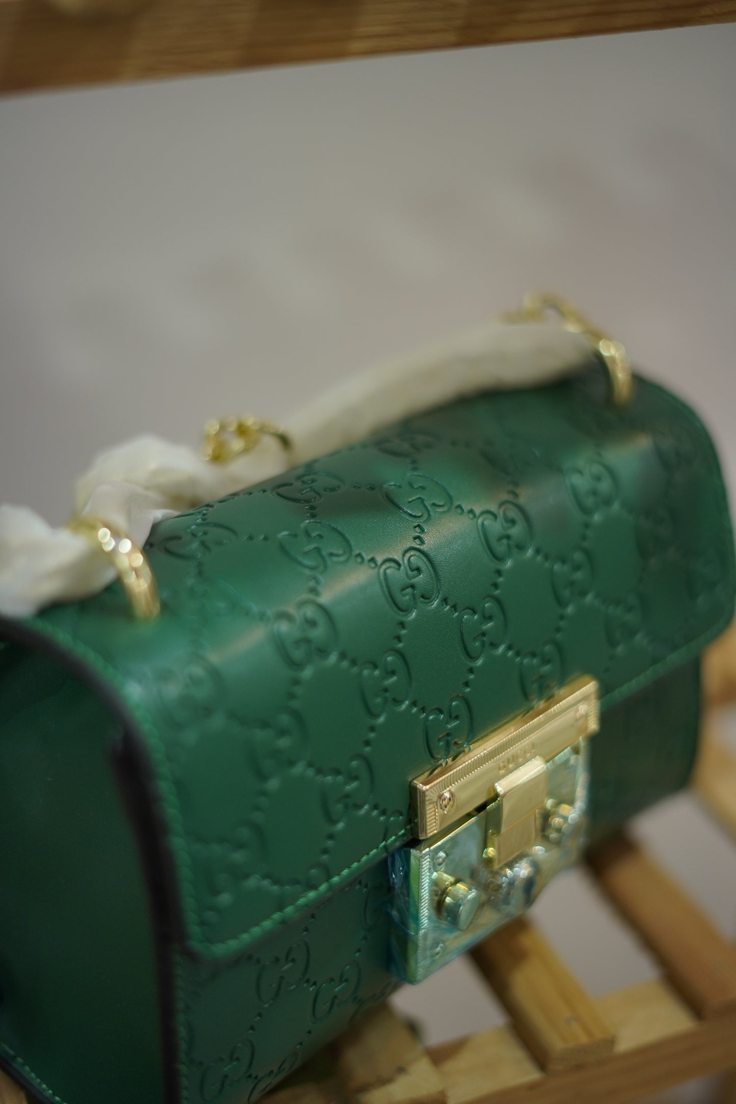 A4. Emerald Signature Lock Crossbody Bag