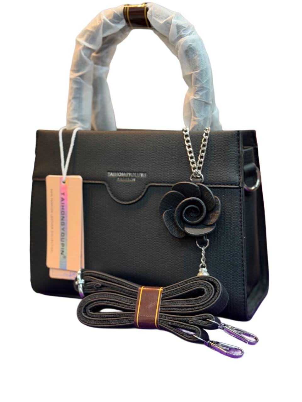 Elegant Black Top Handle Satchel Bag with Floral Charm
