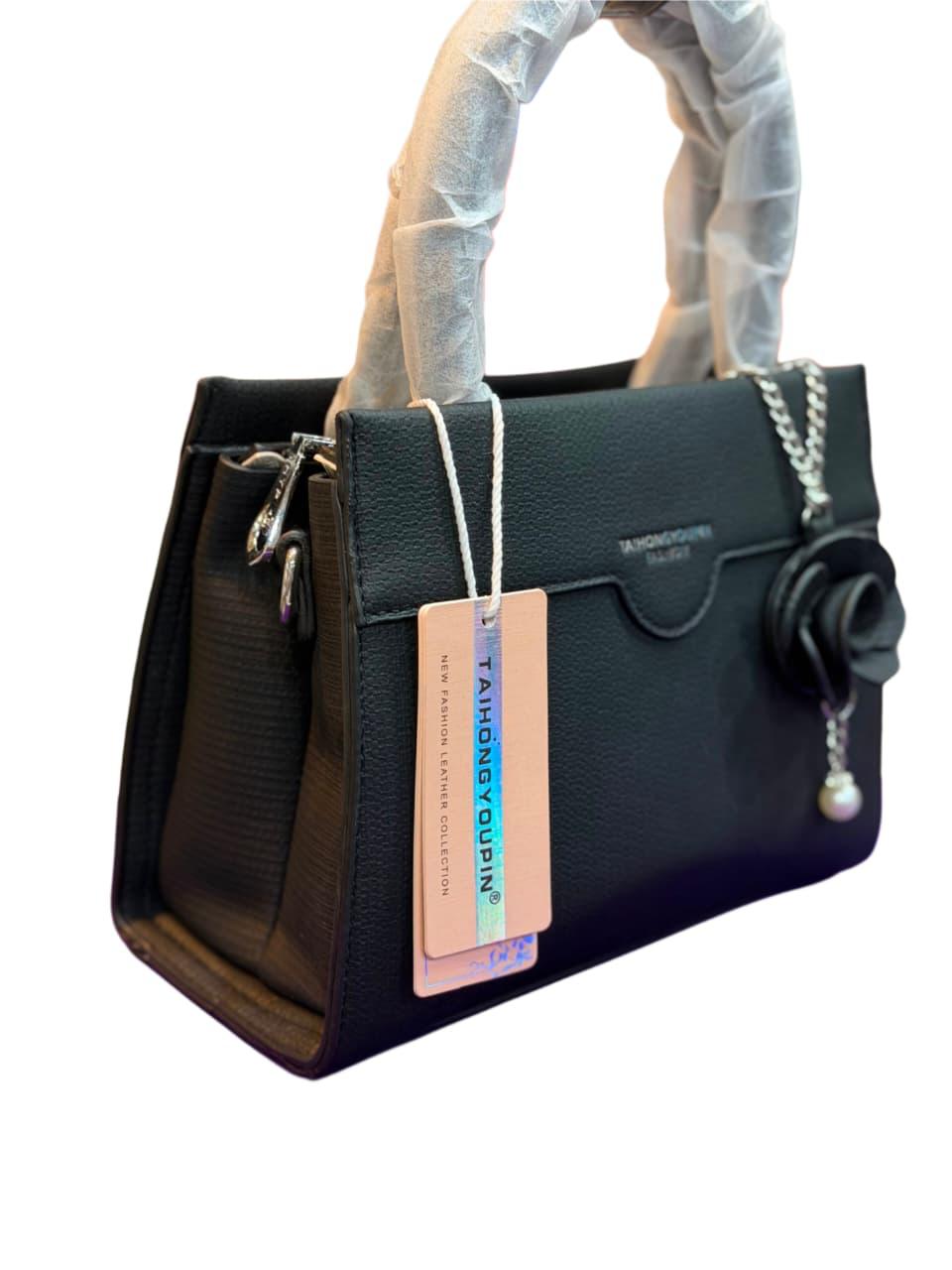Elegant Black Top Handle Satchel Bag with Floral Charm